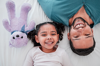 Buy stock photo Portrait of dad, child and teddy bear on bed from above, bonding and love with play time to relax. Smile, happiness and man with kid together in bedroom of family home in morning or bedtime in Mexico