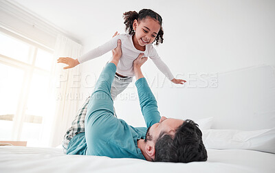 Buy stock photo Fun, playing and a dad holding a child, bonding and pretending to fly in a bedroom. Happy, playful and a little girl flying, feeling free and spending quality time with a father for play at home