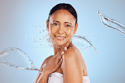 Buy stock photo Old woman, water splash and beauty in portrait, hygiene and sustainable skincare for antiaging on blue background. Shower, clean and female smile, eco friendly dermatology and cosmetic care in studio