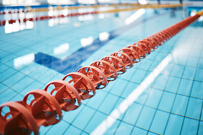 Buy stock photo Water, empty swimming pool and lanes for competition, exercise and workout. Sports, swim and fitness with lane ropes or divider in liquid for aquatic training, exercising or underwater practice.