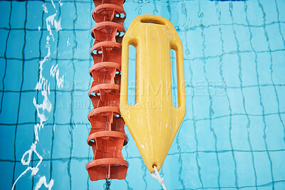 Buy stock photo Above, water and a buoy in a pool for safety, life saving and floating help. Board, summer and equipment for protection, security and danger while swimming, rescuing and protecting from drowning