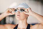 Swimming, face of woman with confidence and goggles at pool for training exercise and wellness and health. Professional water sports, workout and champion USA swimmer at swim competition with pride.