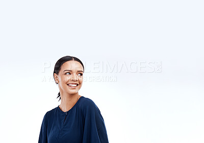 Buy stock photo Woman, smile and studio with a happy modern female looking at mockup for advertisement space. Happiness, joy and gen z female relax with youth and smiling with isolated white background and mock up
