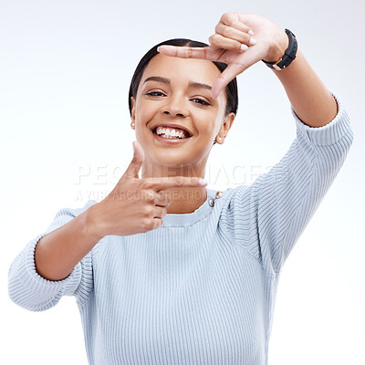 Buy stock photo Frame, hands and portrait of woman on a white background for beauty, cosmetics and natural makeup. Fashion, focus mockup and face of girl isolated with happiness, smile or photography emoji in studio