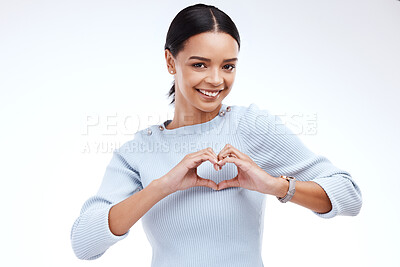 Buy stock photo Portrait, heart and hand gesture with a woman on a white background isolated in studio for health or love. Face, hands and emoji with an attractive young female indoor for romance or valentines day