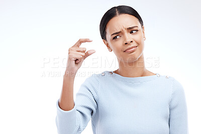 Buy stock photo Woman, hand and small sign in studio with size, gesture or  symbol against white background. Little, icon and finger emoji by girl disappointed on mockup with scale, review or opinion while isolated
