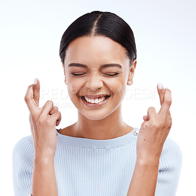 Buy stock photo Fingers crossed, hope and woman with a smile and happiness in a studio with wish. Excited, waiting and hands optimism emoji of a young female ready for winning and lottery prize with white background
