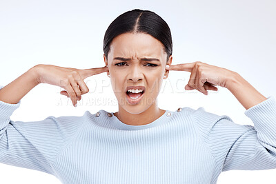 Buy stock photo Portrait, woman and finger in ears for noise, silence and denial gesture on studio white background. Omg, face and angry girl with complaint, ignoring and deaf, wtf and emoji, frustrated and annoyed 