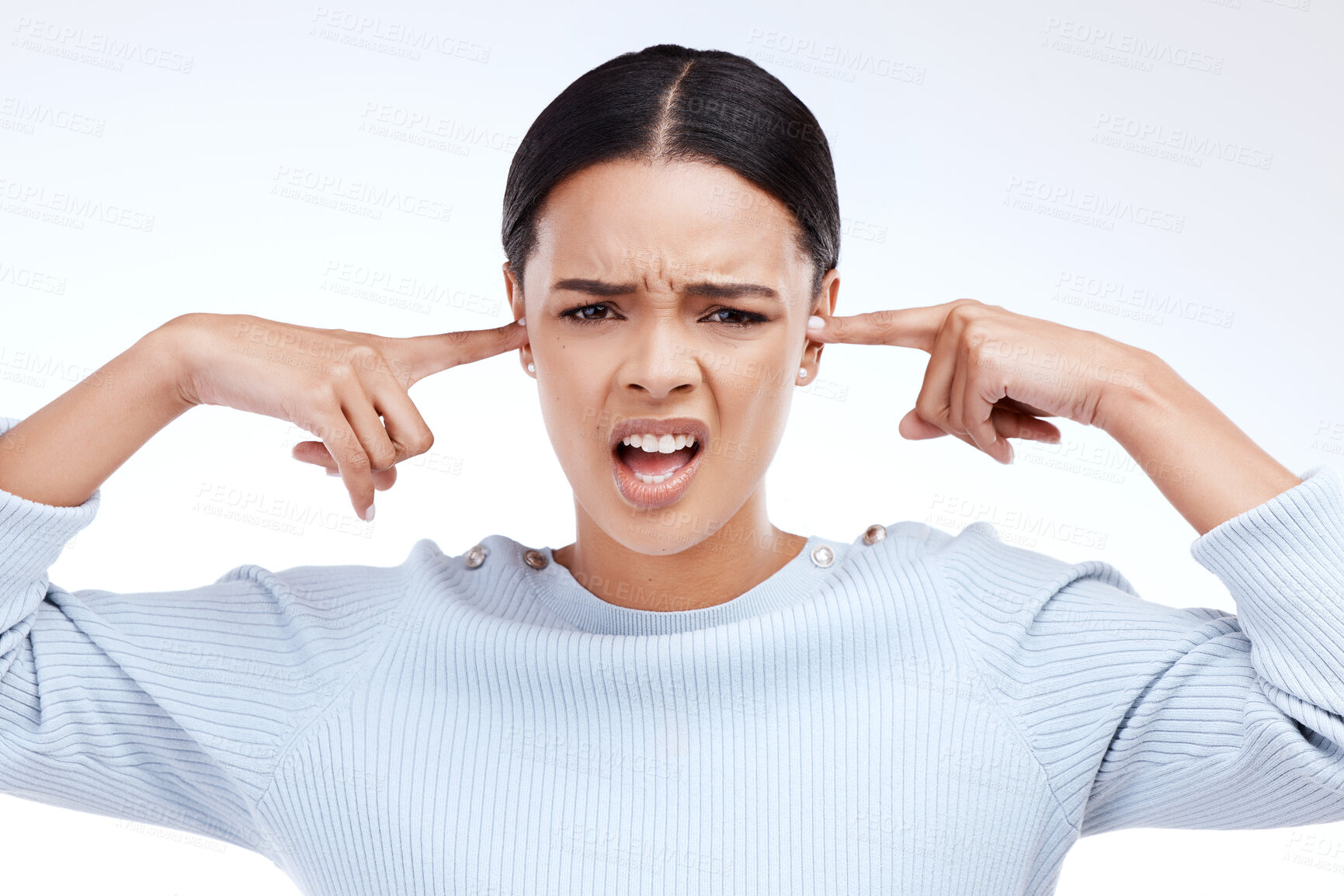 Buy stock photo Portrait, woman and finger in ears for noise, silence and denial gesture on studio white background. Omg, face and angry girl with complaint, ignoring and deaf, wtf and emoji, frustrated and annoyed 