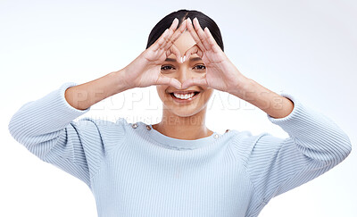 Buy stock photo Heart frame, hands and portrait of woman on a white background for beauty, cosmetics and natural makeup. Love emoji, mockup and face of girl isolated with happiness, smile and confidence in studio