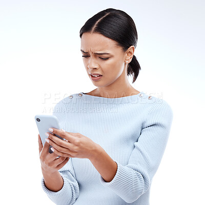 Buy stock photo Confused, woman and phone in a studio reading a phishing, scam and fake news text. Isolated, white background and mobile texting of a young and gen z female with online and spam email with wtf