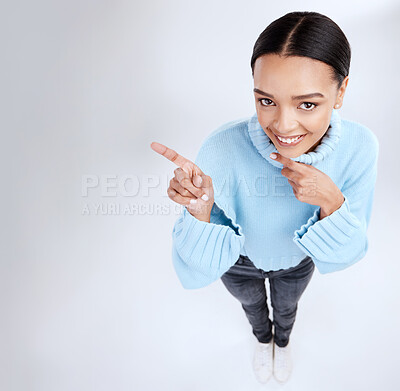 Buy stock photo Happy mockup portrait, woman face and pointing at sales promotion, advertising copy space or discount deal mock up. Brand commercial, studio top view or product placement female on white background