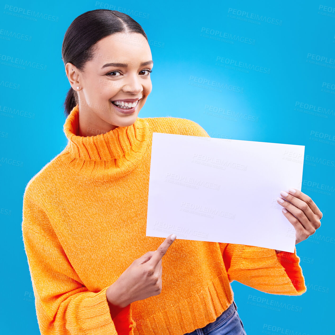 Buy stock photo Pointing, mockup and poster with portrait of woman in studio for idea, branding and announcement. Promotion, space and smile with female and sign on blue background for news, logo and advertising