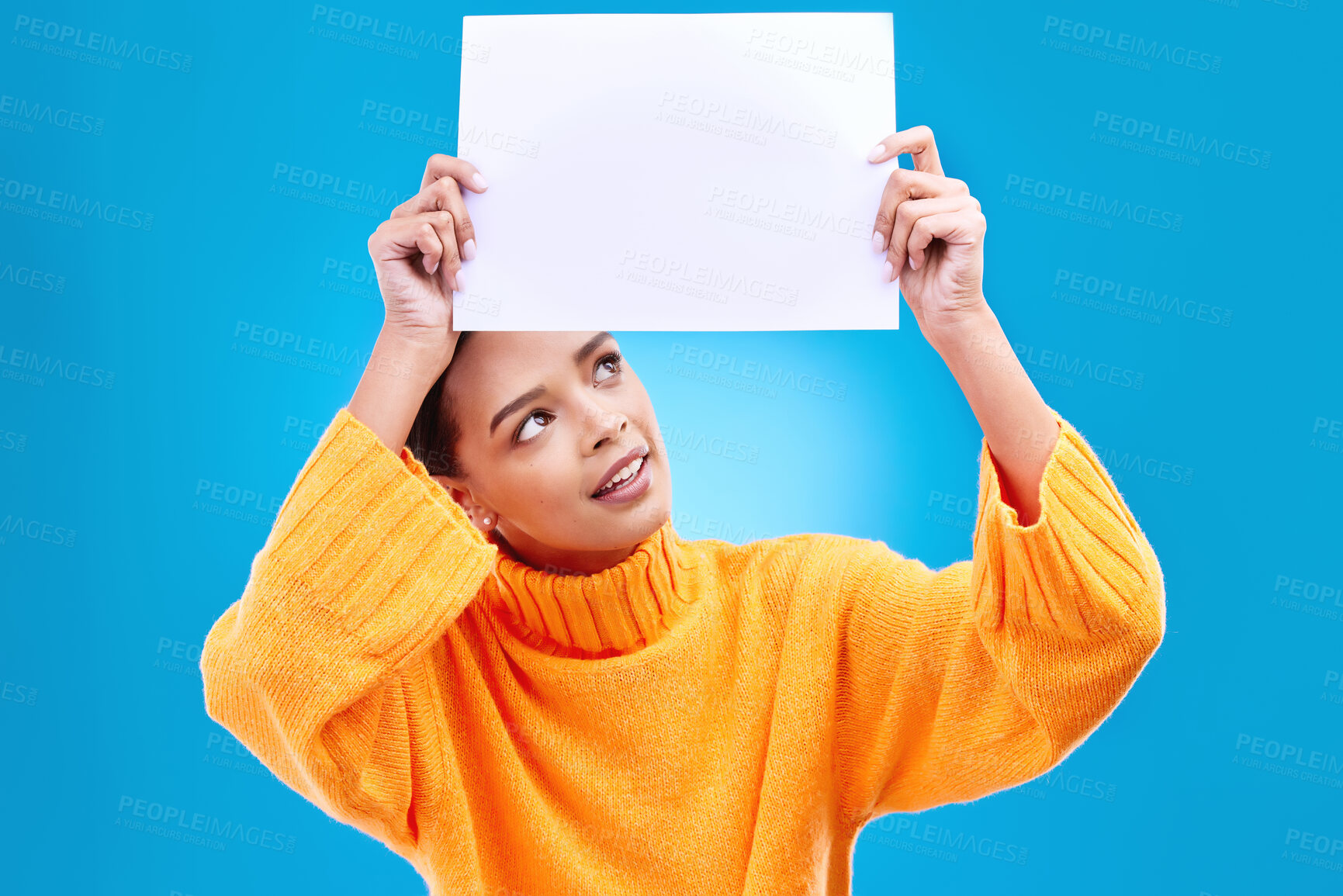 Buy stock photo Poster, thinking and face of woman on blue background for announcement, news and information. Advertising, mockup studio and isolated happy girl with paper sign for brand, logo and marketing