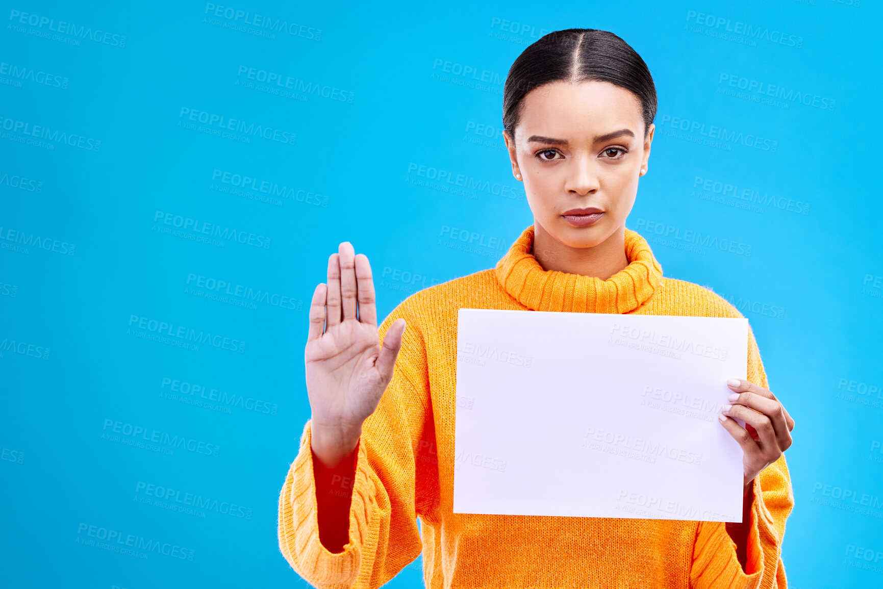 Buy stock photo Serious, stop and woman with a poster in a studio with mockup, copy space and blank space. Confidence, portrait and female model from Brazil with a paper and hand gesture isolated by blue background.