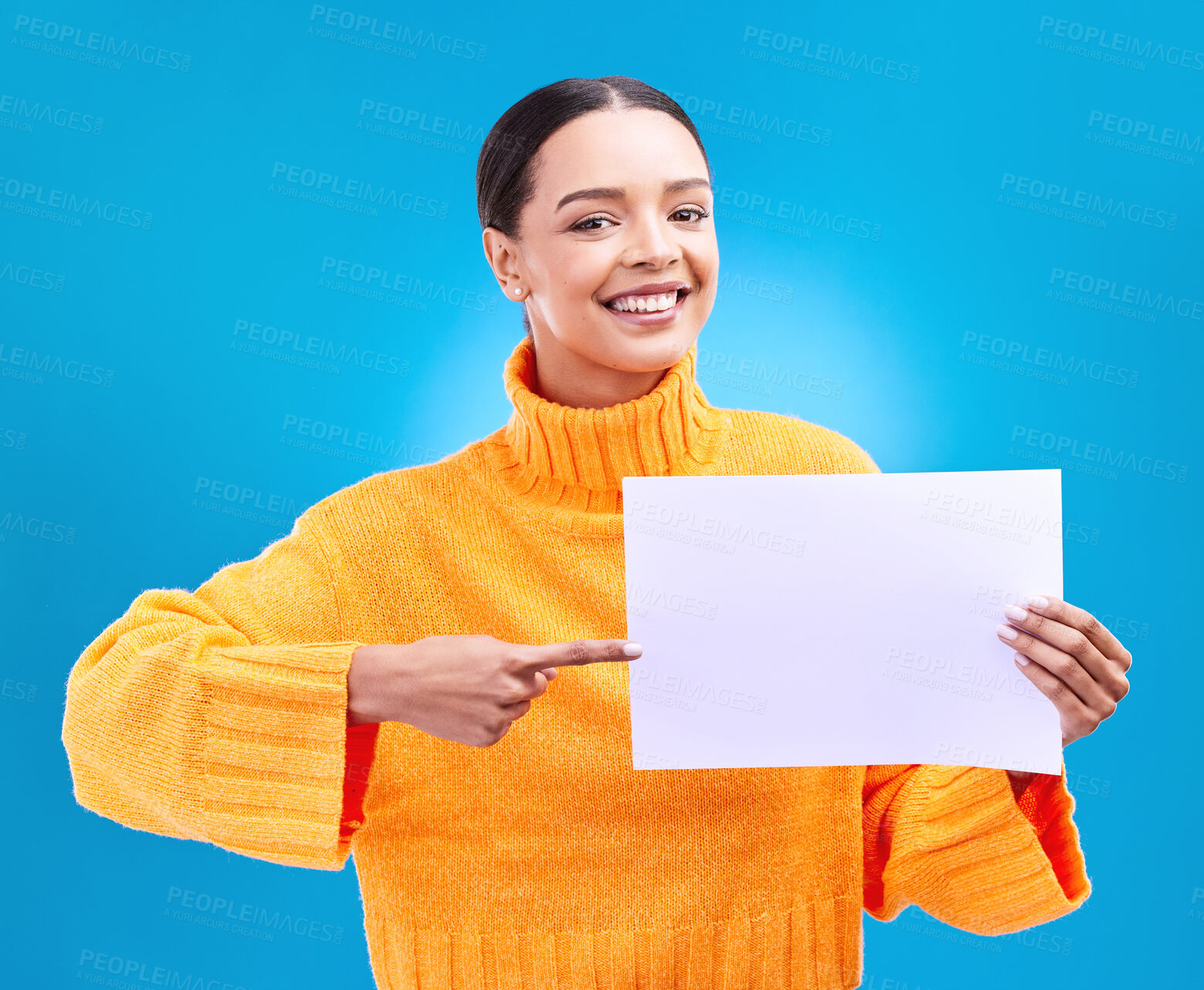 Buy stock photo Poster, point and portrait of woman on blue background for announcement, news and information. Advertising, mockup studio and isolated happy girl with paper sign for brand, logo and product placement