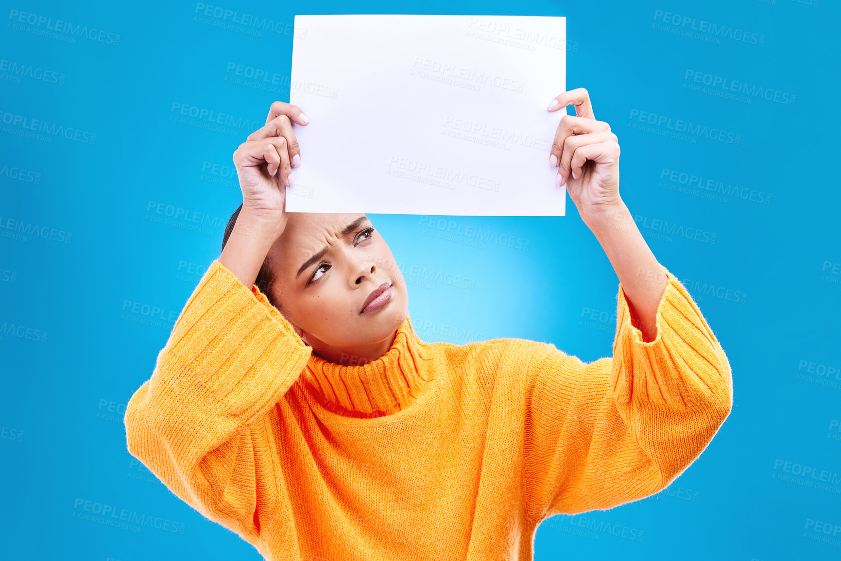 Buy stock photo Paper, banner and confused woman in studio on blue background with space, mockup and poster. Billboard, poster and unsure girl showing blank copy space, branding or isolated logo announcement 