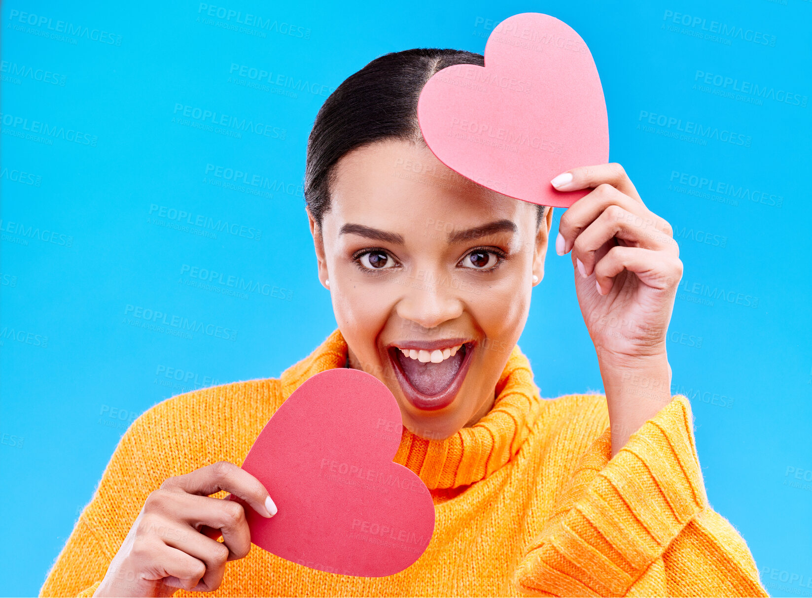 Buy stock photo Paper heart, excited woman and portrait on blue background, studio and emoji icon. Happy female model, love and shape of sign, surprise and celebration of peace, thank you and kindness for valentines