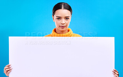 Buy stock photo Studio, blank sign and portrait of woman with info and mockup isolated on blue background. Marketing, advertising and gen z girl with poster for product placement or news announcement mock up space.