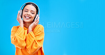 Buy stock photo Music headphones, woman and smile on blue background, mockup studio and backdrop. Happy female, gen z model and listening to sound, streaming album and audio connection on media, mock up and podcast