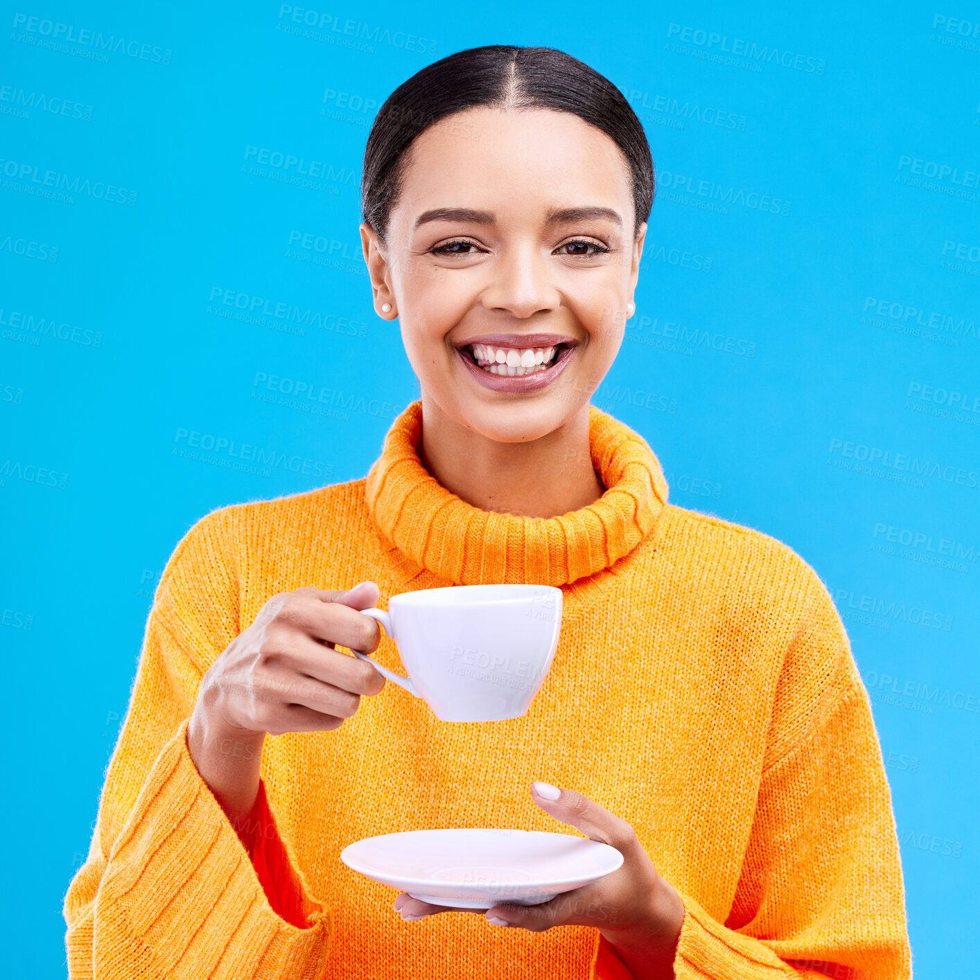 Buy stock photo Tea, woman portrait and smile in studio with happiness, latte or matcha mug. Isolated, blue background and happy female model or young person smiling with casual winter fashion, joy and coffee drink 