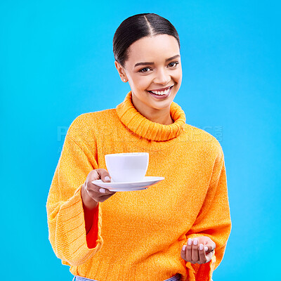 Buy stock photo Woman, portrait and smile with coffee in studio for happiness for cafe advertising and mockup. Face of a happy female model giving tea cup on a blue background in hand for motivation and hospitality