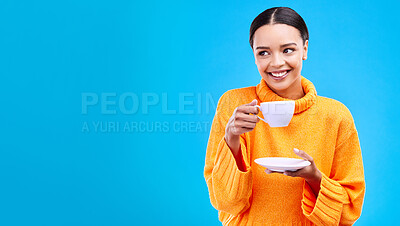 Buy stock photo Tea, woman and smile in studio with mockup and happiness with mug. Isolated, blue background and happy female model and young person relax with casual winter fashion and joy from hot drink smiling