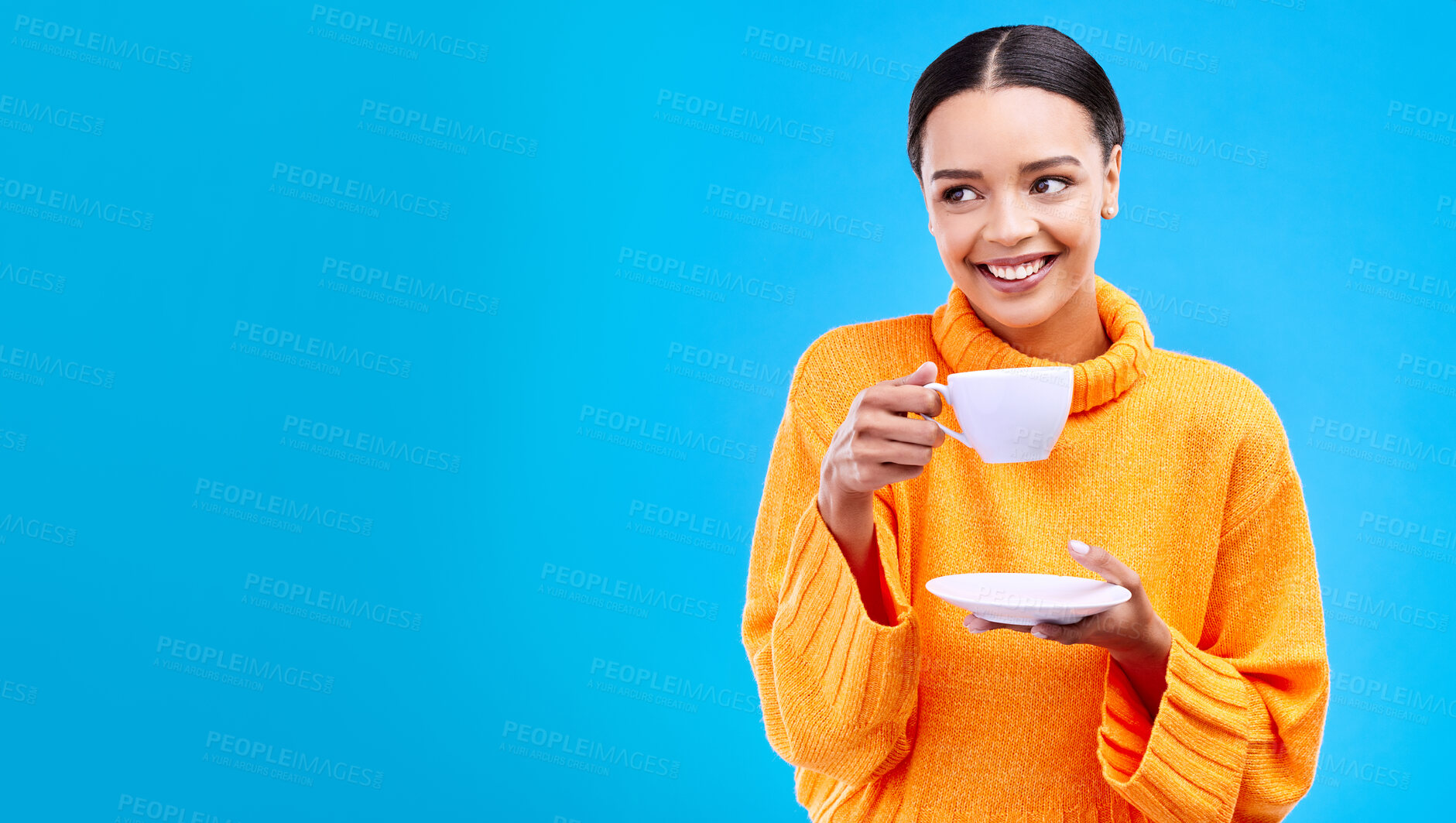 Buy stock photo Tea, woman and smile in studio with mockup and happiness with mug. Isolated, blue background and happy female model and young person relax with casual winter fashion and joy from hot drink smiling