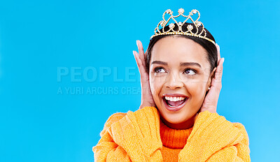 Buy stock photo Mockup, crown or happy with woman in studio for celebration, princess and party. Smile, beauty and fashion with female tiara on blue background and excited for achievement, winner and wow prom event