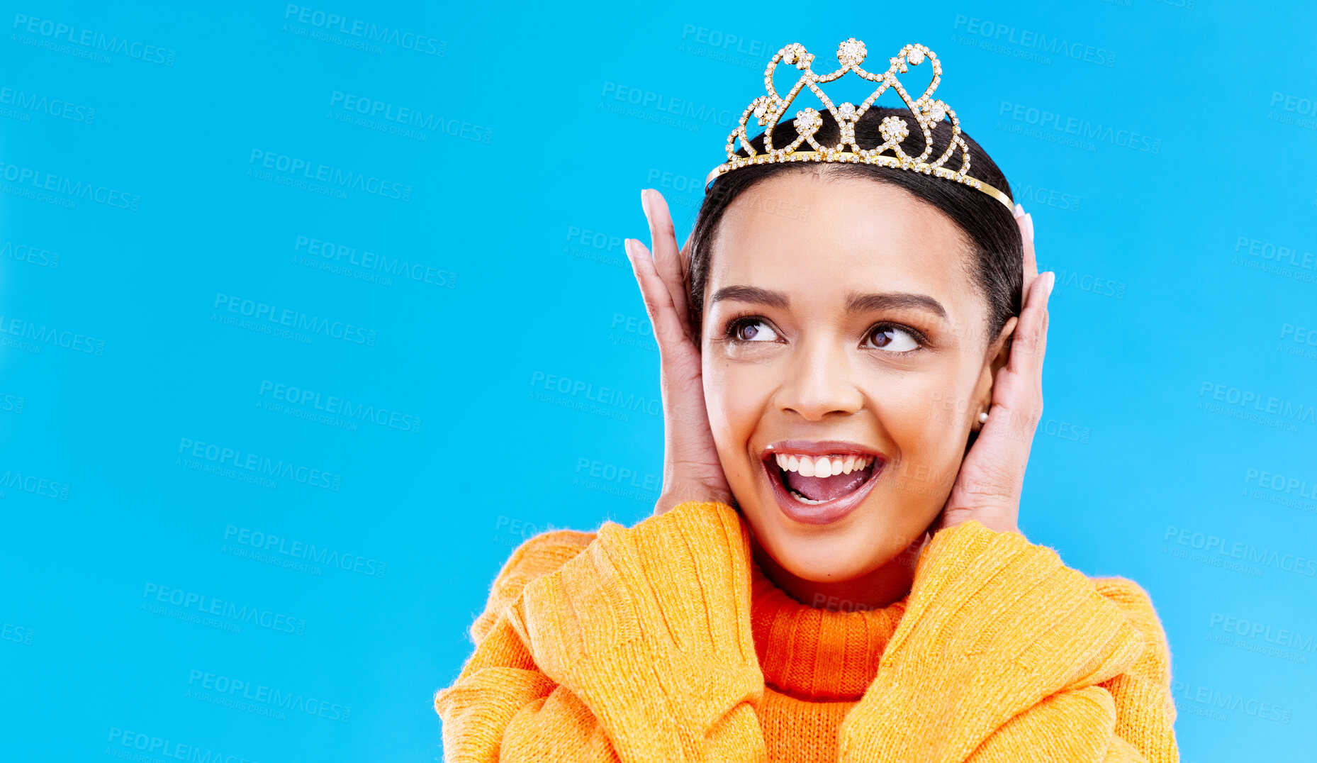 Buy stock photo Mockup, crown or happy with woman in studio for celebration, princess and party. Smile, beauty and fashion with female tiara on blue background and excited for achievement, winner and wow prom event