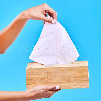 Buy stock photo Tissue, blue background and hands with box for handkerchief for flu, sickness and sinus mockup. Healthcare, toiletries and woman with hygiene wipe, napkin and paper for cleaning, allergy and sneeze