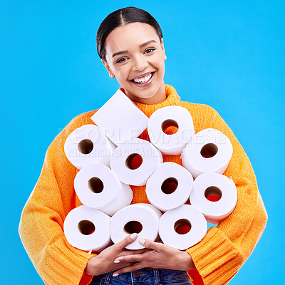 Buy stock photo Toilet paper, young woman and portrait with happiness and smile in a studio. Isolated, blue background and happy female person and youth model with tissue rolls stock and gen z fashion smiling