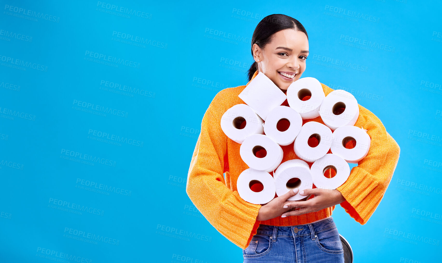 Buy stock photo Toilet paper, happiness and woman portrait with mockup and home inventory stock. Isolated, blue background and studio with a young female holding tissue rolls with a happy smile and joy with mock up 