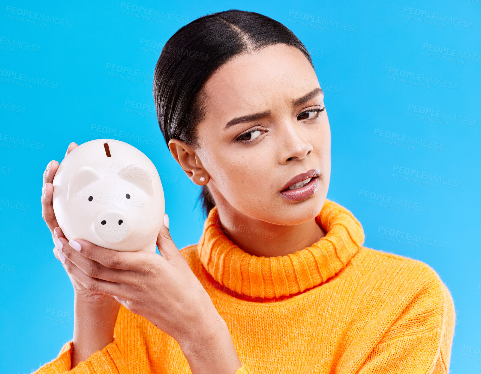 Buy stock photo Piggy bank, investment and woman in a studio saving her money for financial growth or profit. Banking, budget and female model with a cash investing plan with finance knowledge by a blue background.