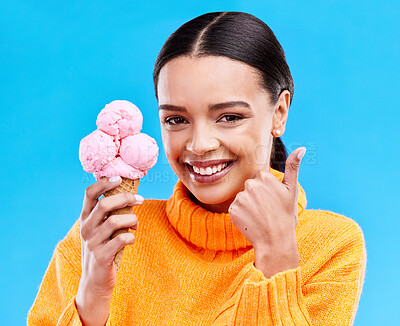 Buy stock photo Woman, studio portrait and ice cream with thumbs up, smile and happiness by blue background. Girl, model and sweet dessert with hand sign, happy and excited for food, gelato and eating by backdrop