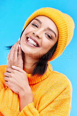 Buy stock photo Happiness portrait, excited and woman with youth in studio ready for cold weather with winter hat. Isolated, blue background and positivity with a young and gen z person with a smile, beanie and joy