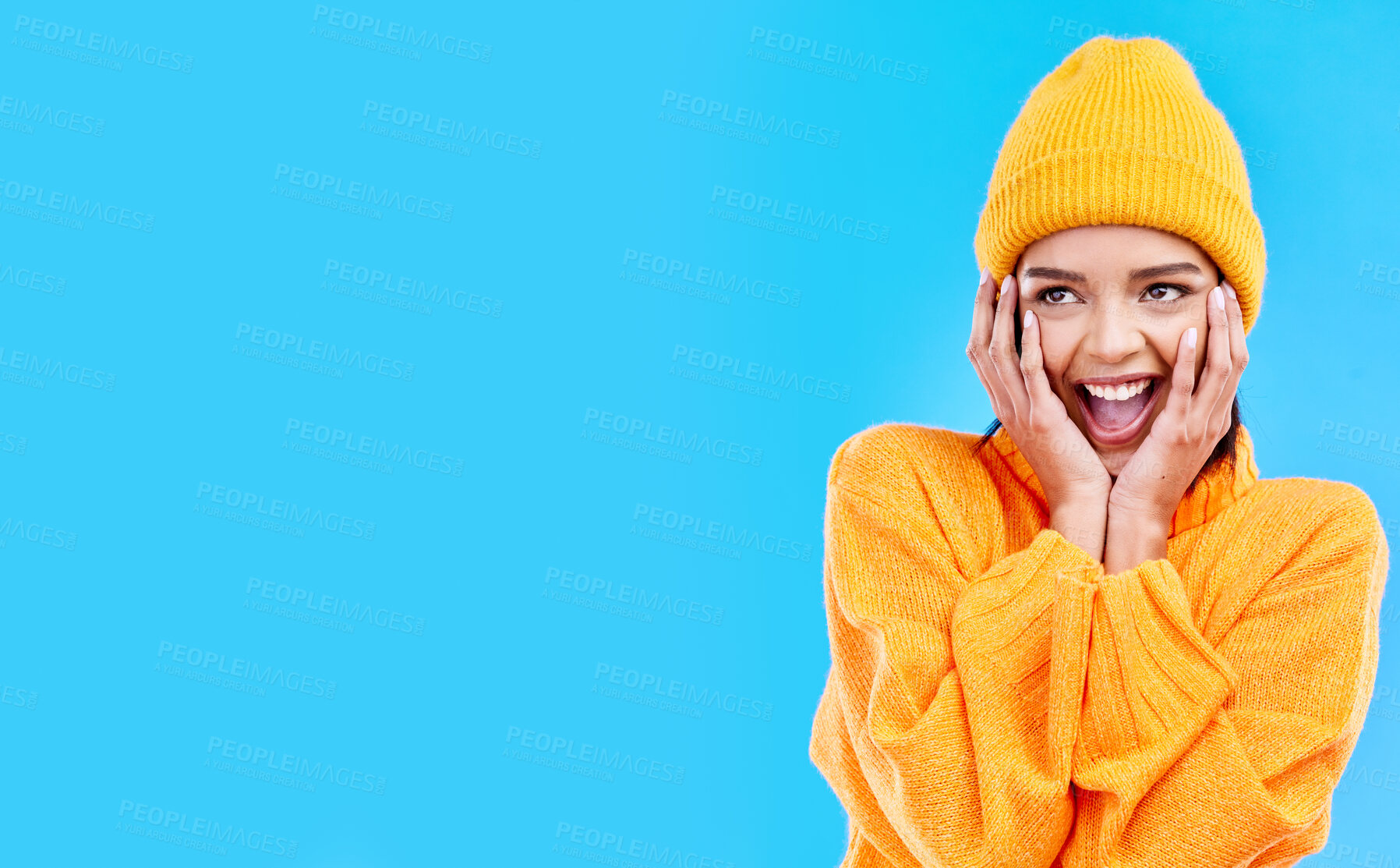 Buy stock photo Happiness, surprised and woman hands on studio mockup ready for cold weather with winter fashion. Isolated, blue background and surprise emoji with a happy, young and gen z person with wow and smile