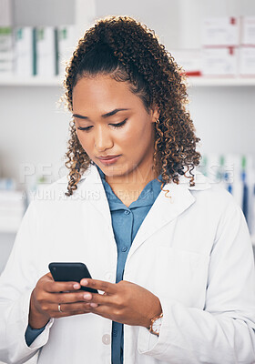 Buy stock photo Pharmacist woman, phone and texting in store for contact, email communication or reading chat. Pharmacy, female and smartphone for social media app, typing and medical news on internet in workplace