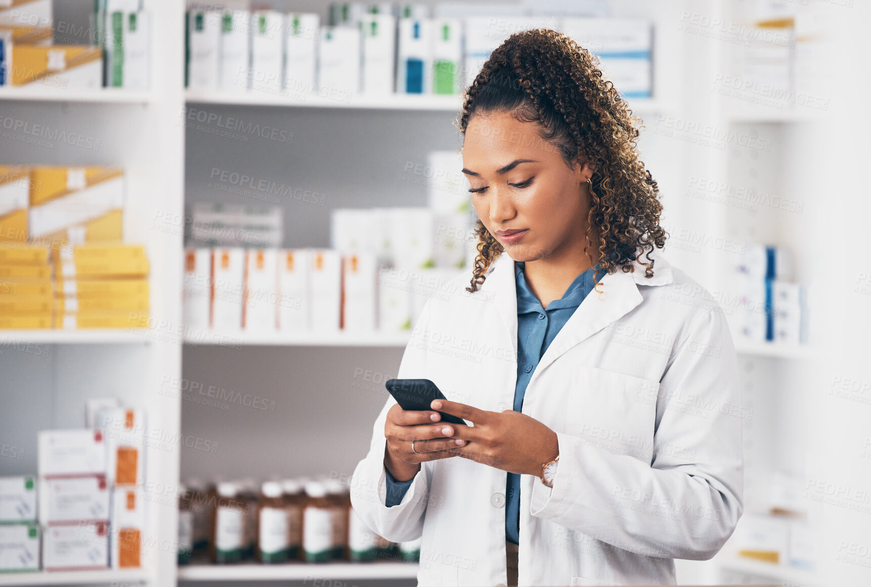 Buy stock photo Pharmacist woman, smartphone and texting in store for contact, email communication or reading chat. Pharmacy, female and phone for social media app, typing and medical news on internet in workplace