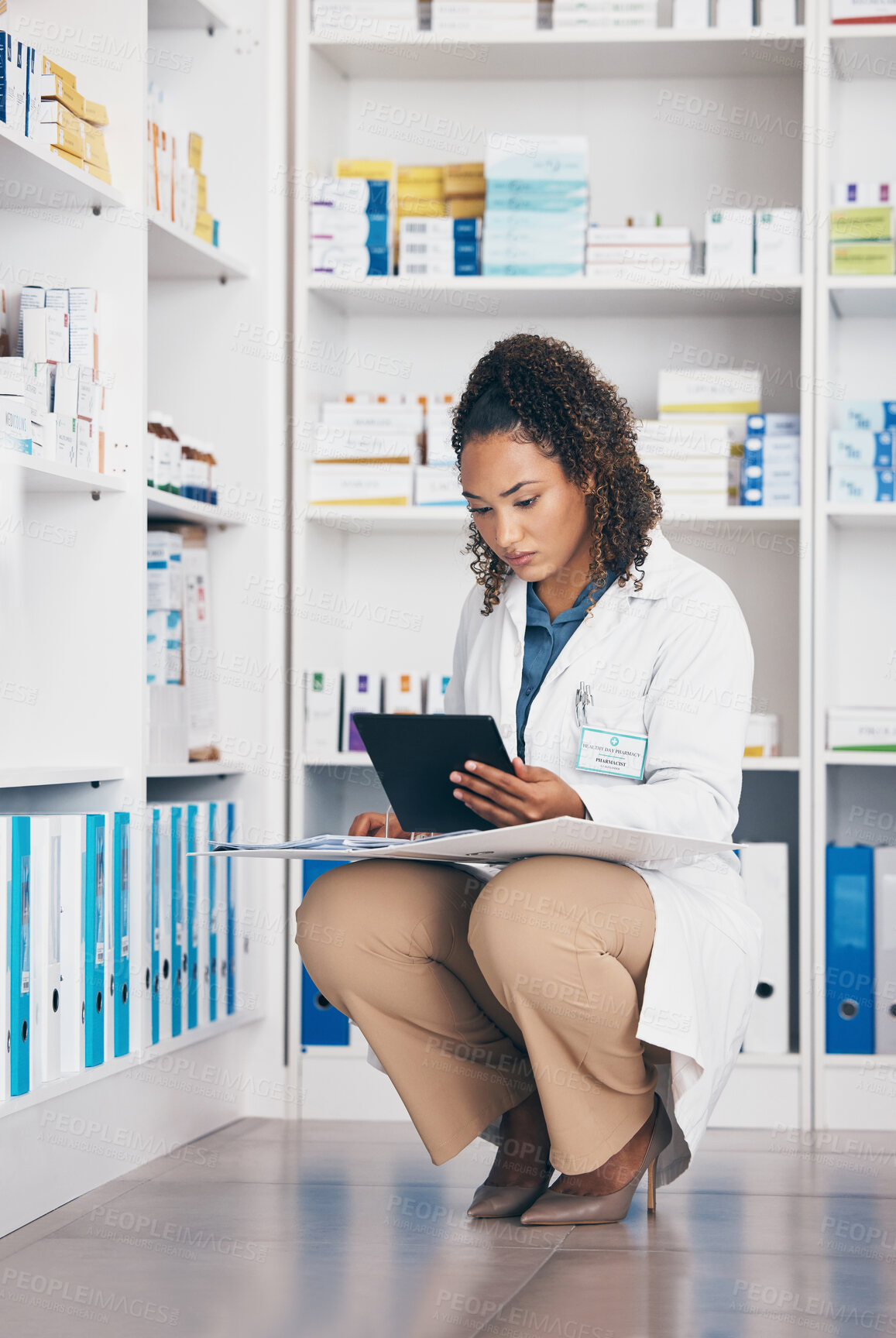 Buy stock photo Pharmacy, focus and pharmacist woman on tablet for medicine management, stock research or inventory. Digital, product logistics and retail or medical doctor, checklist and pharmaceutical folder check