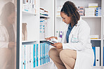 Tablet, stock and product with a woman in a pharmacy to fill an online order of prescription treatment. Medical, healthcare and insurance with a female pharmacist working as a medicine professional