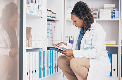 Buy stock photo Tablet, stock and product with a woman in a pharmacy to fill an online order of prescription treatment. Medical, healthcare and insurance with a female pharmacist working as a medicine professional