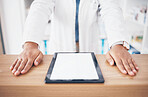 Tablet, mockup or hands of woman pharmacist on table ready to help with healthcare services. Marketing space, digital or closeup of doctor by desk counter with medicine online research in drugstore