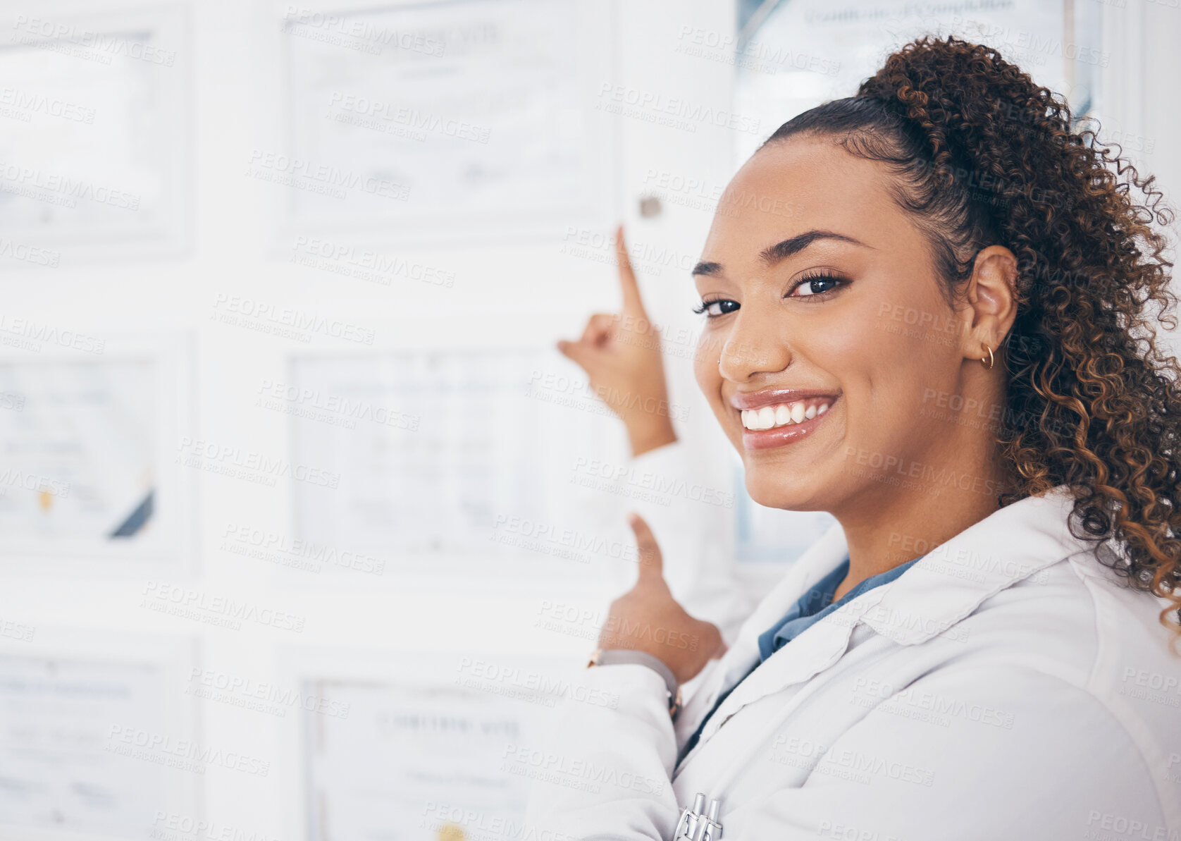 Buy stock photo Portrait, pointing and healthcare award with a woman proud of her medical achievement in the hospital. Face, smile and happy with a female medicine professional showing her certificate in a clinic