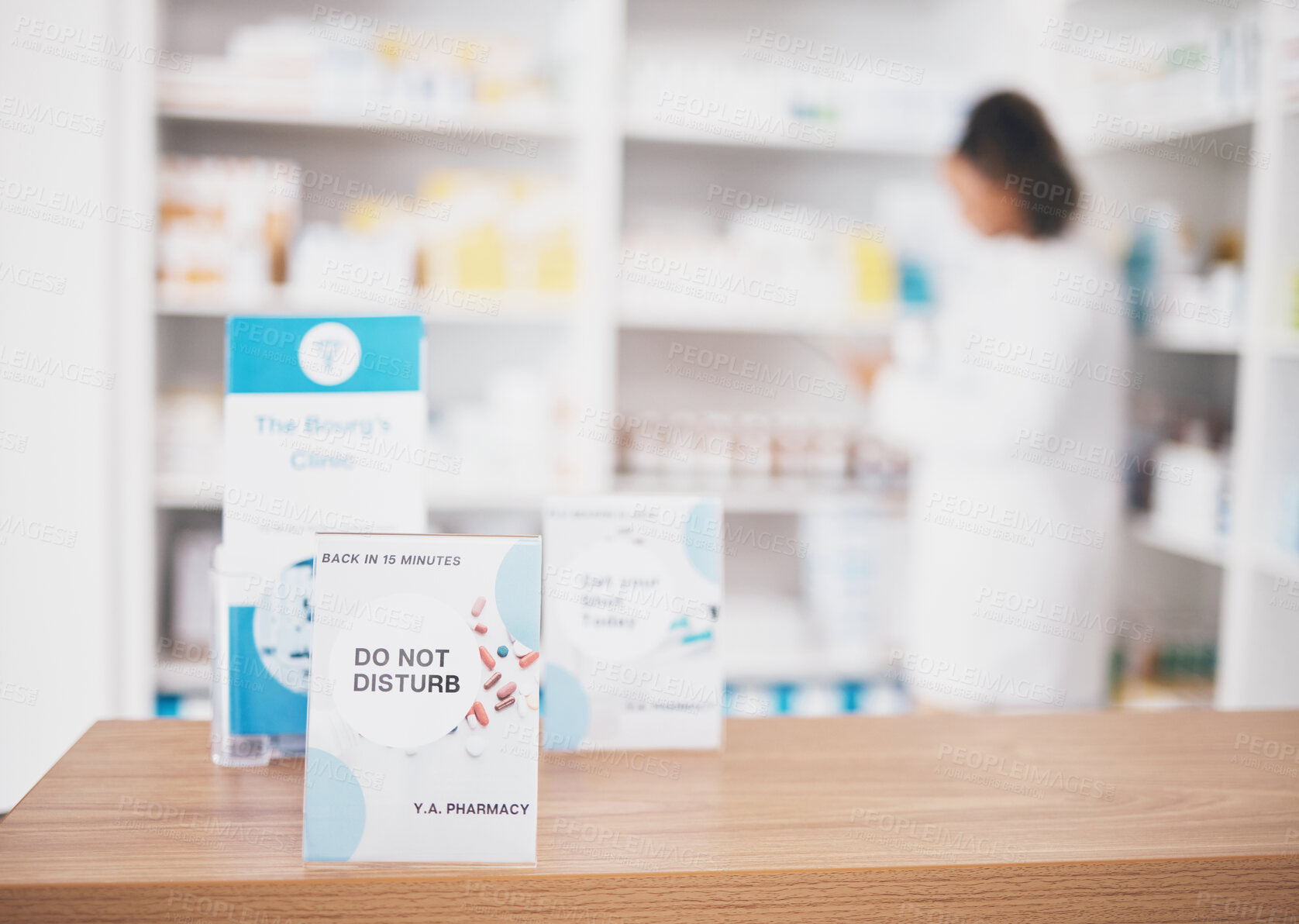 Buy stock photo Employee break, pharmacy sign and shop poster of an busy retail board in healthcare store. Medical, wellness and doctor practice with a do not disturb placard and billboard on worker desk at clinic