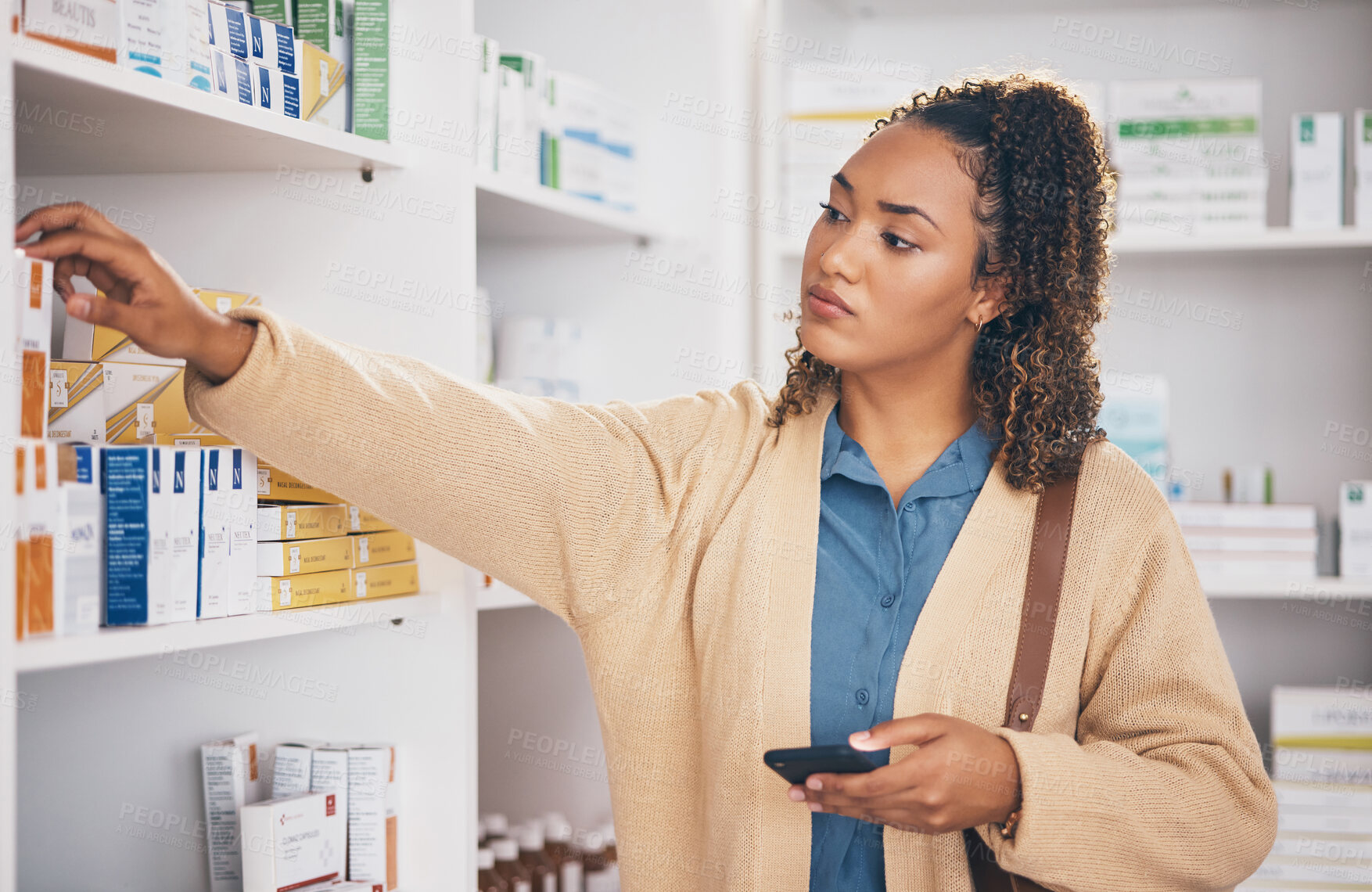 Buy stock photo Pharmacy, medicine and female customer choosing healthcare products or drugs in a drugstore. Dispensary, medical and woman patient shopping for medication in retail pharmaceutical shop or chemist.