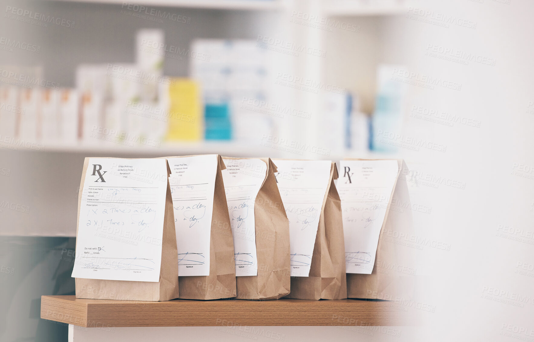 Buy stock photo Healthcare, pharmacy and prescription medicine in paper bag, product and pills at counter of drugstore service. Pharmaceutical background, empty retail dispensary and medical supplements in package