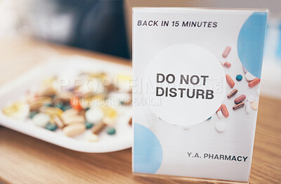 Buy stock photo Sign, healthcare and medication in an empty pharmacy for the treatment or cure of disease and insurance. Do not disturb, medical and medicine box, package or container in a pharmaceuticals clinic