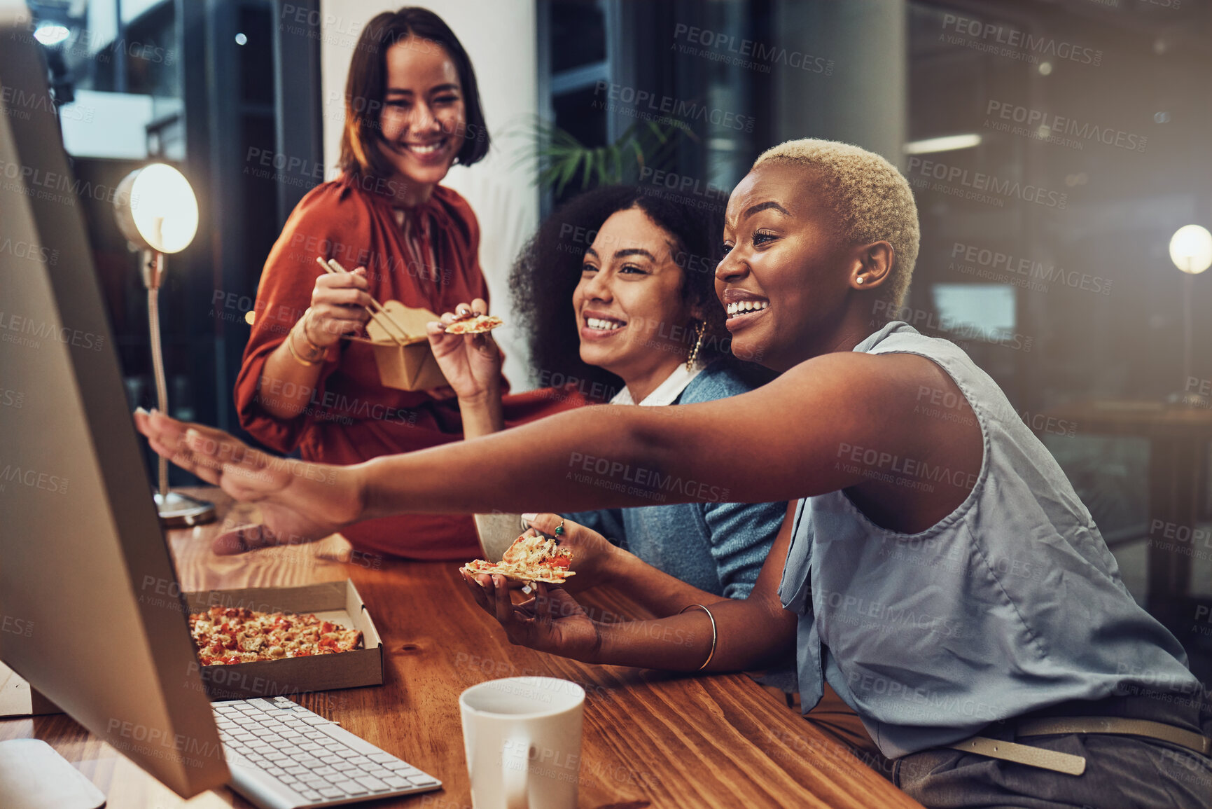 Buy stock photo Night work, happy and women with food for a deadline, coworking and overtime with computer proposal. Laughing, funny meme and business people reading communication on a pc while eating in late shift