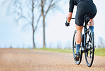 Bicycle, outdoor and person on a bike ride with mockup for sports race on a gravel road. Fitness, exercise and fast athlete doing sport training in nature on a park trail for cardio and workout